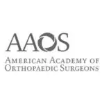 American Academy of Orthopaedic Surgeons (AAOS) logo — bold typographic wordmark with circular emblem and full organization name displayed in greyscale